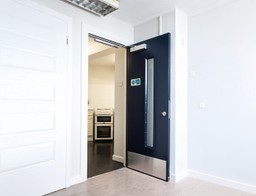 A modern fire-rated glass panel integrated into a certified fire door.&quot;
