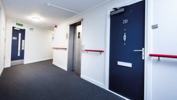 A certified fire door set from Gerda Security installed in a residential high-rise.
