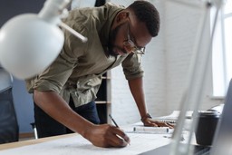 An architect reviews safety plans, as part of Gateway 2.