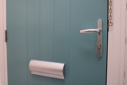 Fire-resistant door frame and hardware on a Gerda fire door set.