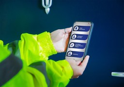Facility manager checking fire door status using the Gerda Security G-Smart™ app.
