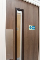 Close-up of a fire door with an FD30 label.